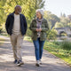 Older adults walking together outdoors as part of an active healthy aging routine